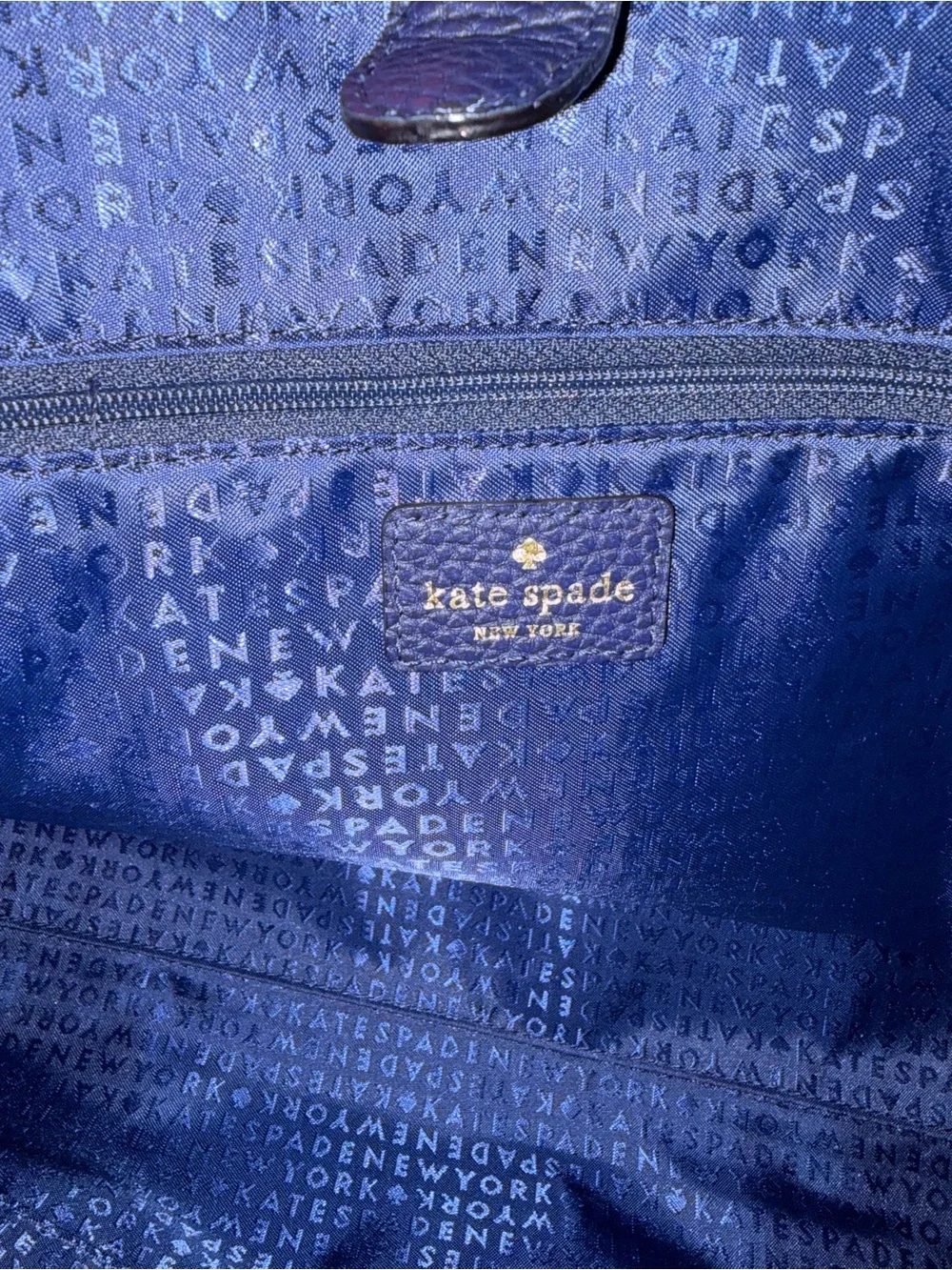 kate spade pebbled leather tote in navy with gold logo